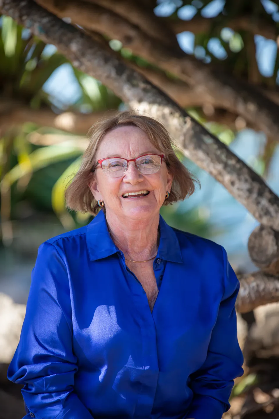 Judy Hinwood in a blue shirt in her garden